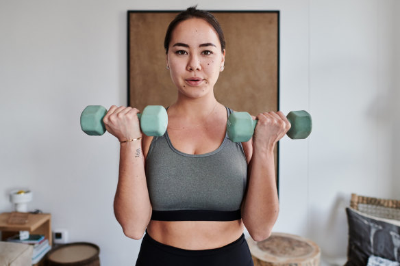 Premium Photo  Female bodybuilder doing the seated dumbbell bicep