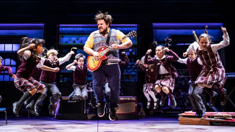 Dewey Finn (played by Brent Hill) rocks the class in Andrew Lloyd Webber’s School of Rock.