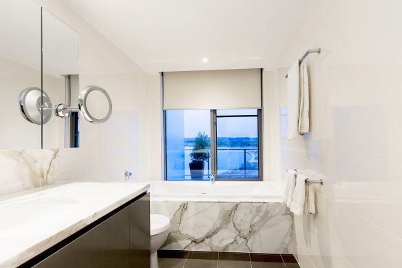 The home features marble bathrooms.