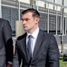 Ryan Bayldon-Lumsden (right) walks next to his legal team outside Southport Courthouse.