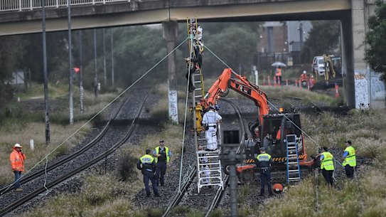 Protestors tied themselves to a pole on a cargo train line near Port Botany in Pagewood on Thursday morning.