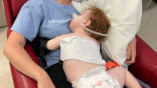 Doctors say 14-month-old Gold Coast toddler Dustin Wildman is slowly improving after accidentally ingesting metallic rose gold dust powder, but have warned he could suffer “lifelong issues”.