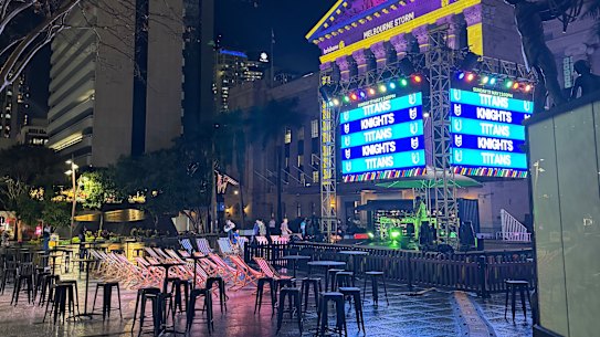 Puddles around a Magic Round activation in King George Square on Thursday night.