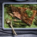 One tray baked fish and creamed greens.