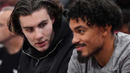 Josh Giddey speaks with Tre Jones.