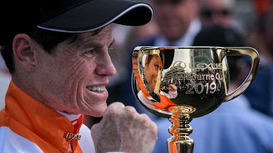Craig Williams with the Melbourne Cup trophy. 