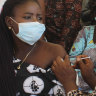A Nigeria civil servant receives a dose of the AstraZeneca coronavirus vaccine.