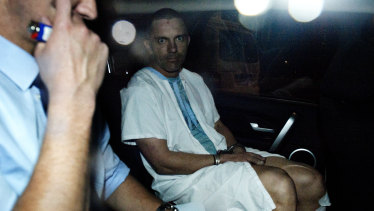 Jacob Michael Smith, then 38, being driven away from the Dutton Park police station in August 2014.