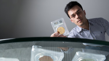 Eric Eigner, founder of Drake Sterling Numismatics, with some of the collectable coins he sells.
