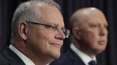Prime Minister Scott Morrison and Minister for Home Affairs Peter Dutton address the media.