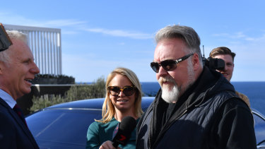 Kyle Sandilands outside John Ibrahim's home during a police raid in July 2018.
