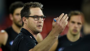 Up 'n' at 'em: David Teague addresses his players during a break in the round 6 match against the Bulldogs.