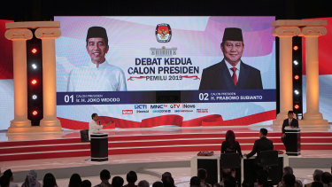Indonesian President Joko Widodo, left, gestures towards his opponent, Prabowo Subianto, during a second presidential debate in Jakarta on Sunday.