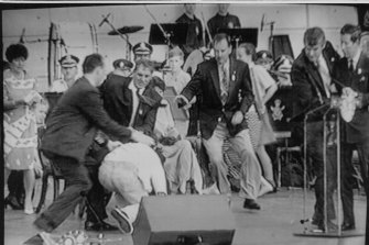 From left, a policeman, then-NSW premier John Fahey and Ian Kiernan rush to subdue an attacker as Prince Charles, right, is ushered away by a security man during an event at Darling Harbour in January 1994.
