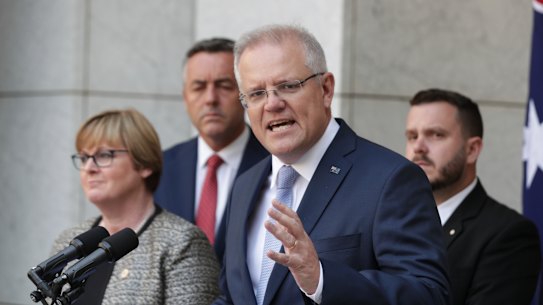 Prime Minister Scott Morrison, Minister for Defence Linda Reynolds, Minister for Veterans and Defence Personnel Darren Chester, second left, and Liberal MP Phil Thompson, right, announcing the national commissioner to examine veteran suicide in February. 