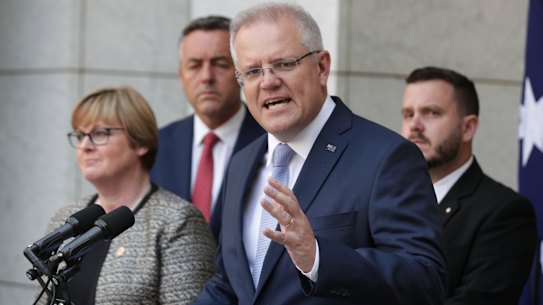 Prime Minister Scott Morrison, Minister for Defence Linda Reynolds, Minister for Veterans and Defence Personnel Darren Chester at a press conference on Wednesday. 