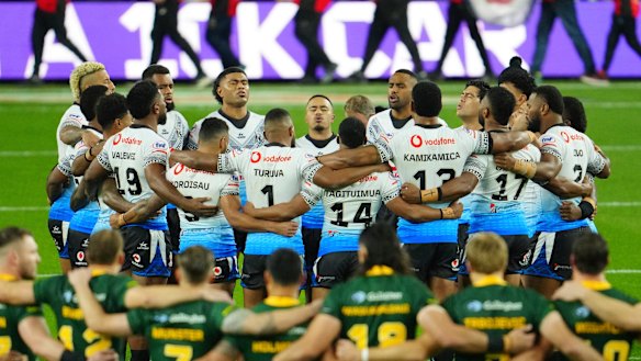 Fiji’s players sing a prayer before the start of their Rugby League World Cup match against Australia.