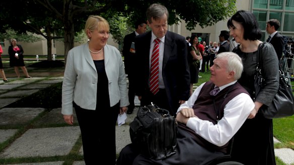 John Walsh (bottom right) in 2011, then associate commissioner of the Productivity Commission, with ministers in the then-Labor government, Jenny Macklin and Bill Shorten.
