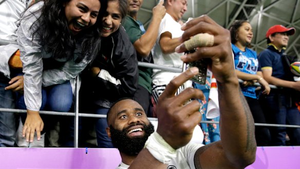 Semi Radradra takes a selfie for fans in Oita after the loss to Wales in the Rugby World Cup.