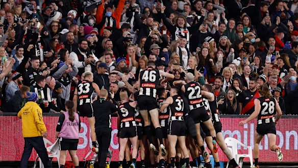 Collingwood celebrate Jamie Elliott’s post-siren match-winner against Essendon in round 19 last year.