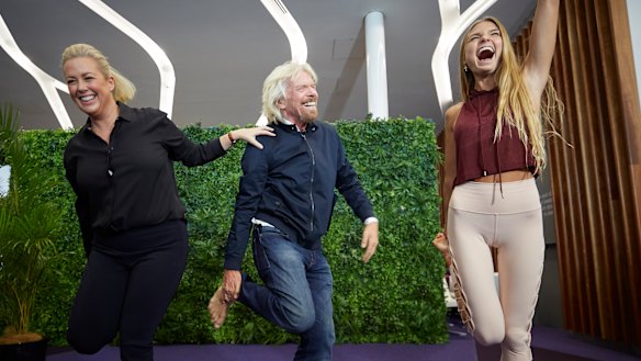 Sir Richard Branson and Sunrise's Samantha Armytage learning yoga from Sjana Elise Earp at the Virgin Lounge at Sydney Airport on Thursday.