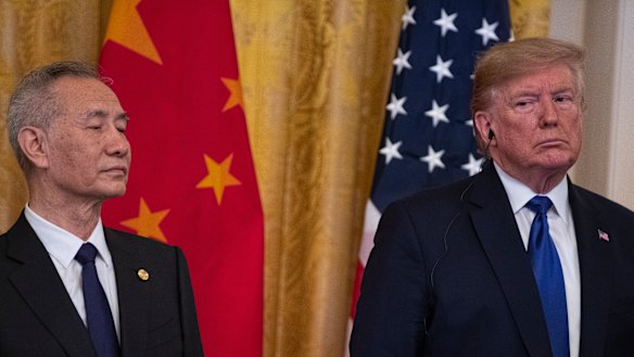 Uneasy truce: Donald Trump with Chinese Vice Premier Liu He before the "Phase One" deal was signed in January.