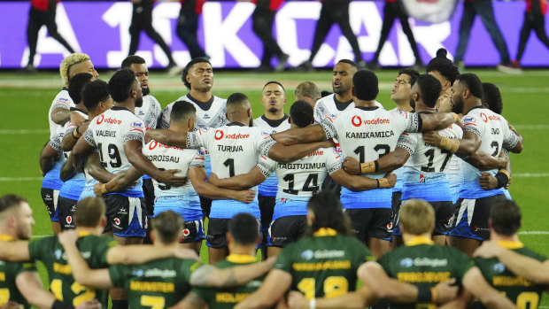 Fiji’s players sing a prayer before the start of their Rugby League World Cup match against Australia.