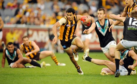 Cyril Rioli gets by Port players.