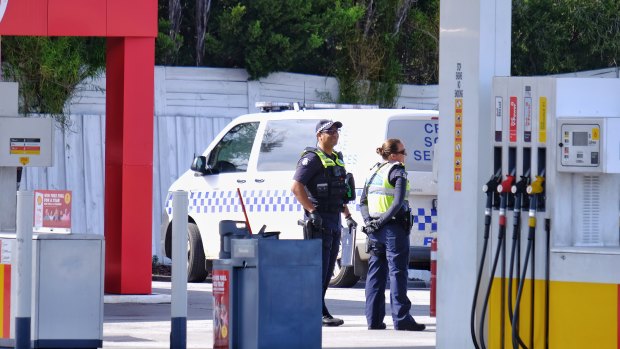 Police at the Coles Express service station on Melton Highway near Taylors Lakes on Saturday morning. 