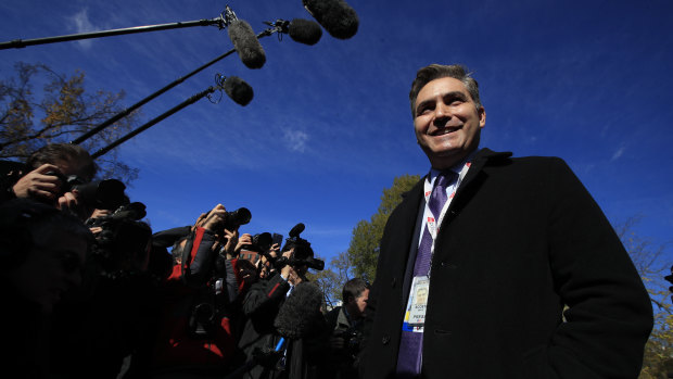 CNN's Jim Acosta speaks to journalist on the North Lawn upon returning to the White House on Friday.
