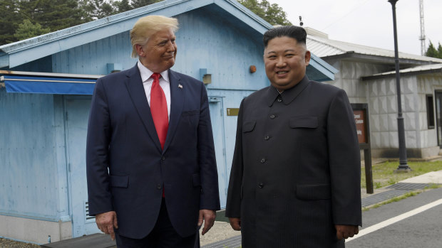 President Donald Trump, left, meets with North Korean leader Kim Jong-un at the border village of Panmunjom in the Demilitarised Zone.