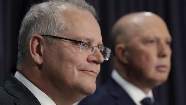 Prime Minister Scott Morrison and Minister for Home Affairs Peter Dutton address the media.