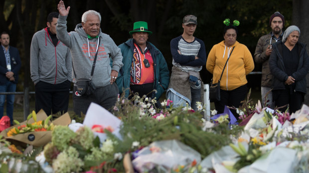 A Maori elder leads a prayer in language at a makeshift shrine of flowers near the Al Noor Mosque. 