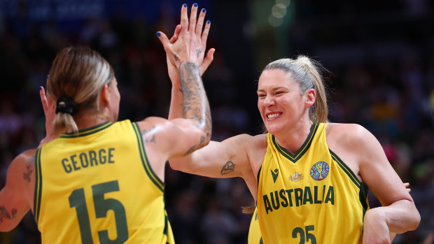 Lauren Jackson (right) and Cayla George celebrate the Opals’ key win.