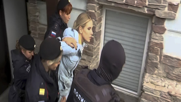 Police detain Russian opposition activist Lyubov Sobol near her office in Moscow on August 10.