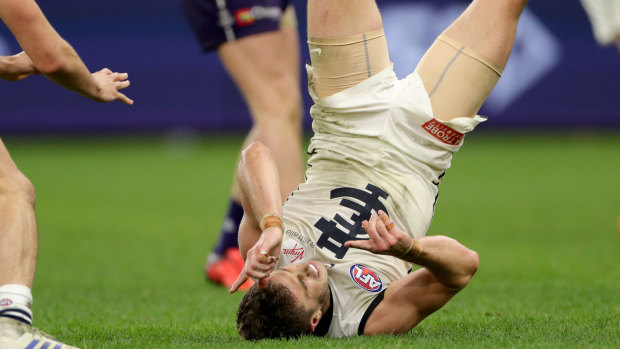 Head over heels: Marc Murphy starts celebrating after booting the winning goal in the last minute for Carlton.