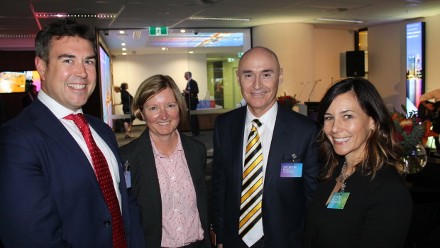 Brendon Riley (middle right) at the launch of the Telstra customer insight centre in Perth on Monday.