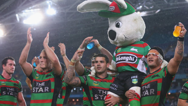 Adam Reynolds and Issac Luke carry Reggie the Rabbit from the field after the passing of Charlie’s wife back in 2013.