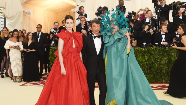 Piccioli at May’s Met Gala with actors Anne Hathaway (left) and Frances McDormand, who says of her Valentino gown, “It’s the most fun I’ve ever had in an article of clothing.” 