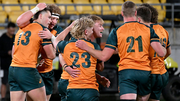 The Junior Wallabies celebrate a try to Henry O’Donnell on Saturday.