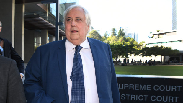 Businessman Clive Palmer leaves the District Court in Brisbane.