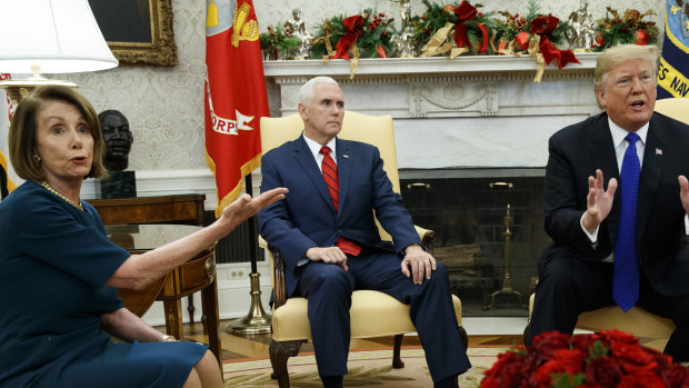 Vice-President Mike Pence, centre, looks on as Democratic House Leader Nancy Pelosi argues with President Donald Trump during a meeting in the Oval Office of the White House.