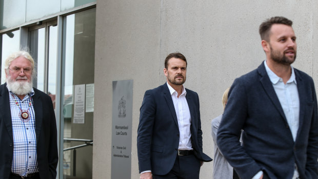 Geoff Clark outside court with his sons Jeremy and Aaron earlier this year.