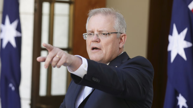 Prime Minister Scott Morrison announcing new measures to stem damage from the coronavirus crisis at Parliament House in Canberra on  Sunday.
