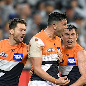 Tim Taranto (centre) roars.