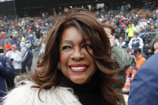 Mary Wilson is escorted after singing the national anthem before a baseball game between the Detroit Tigers and the Kansas City Royals in Detroit in 2019.