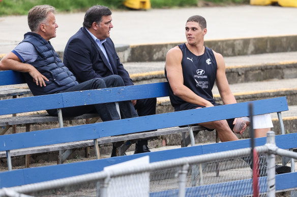 Charlie Curnow watches on from the stands during a Carlton training session at Princes Park last Friday.