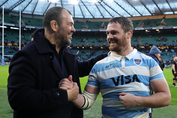 Michael Cheika shakes hands with Julian Montoya after the win over England.