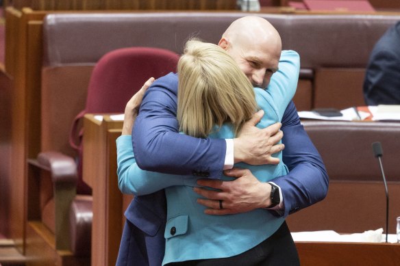 Senator David Pocock and Finance Minister Katy Gallagher embraced after the territory rights bill passed the senate on Thursday night.