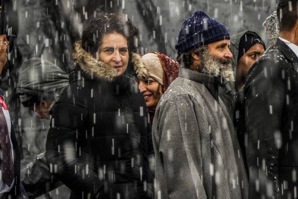 India’s opposition Congress party leaders Rahul Gandhi, centre right and Priyanka Vadra, centre left arrive for a public rally as it snows in Srinagar, Indian controlled Kashmir.